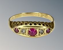 An 18ct yellow gold ruby and diamond ring, size P.