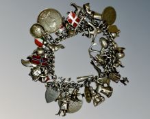 A heavy silver charm bracelet, 118.0g.