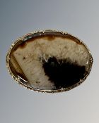 A large antique hardstone brooch in yellow metal mount, width 7.5cm.