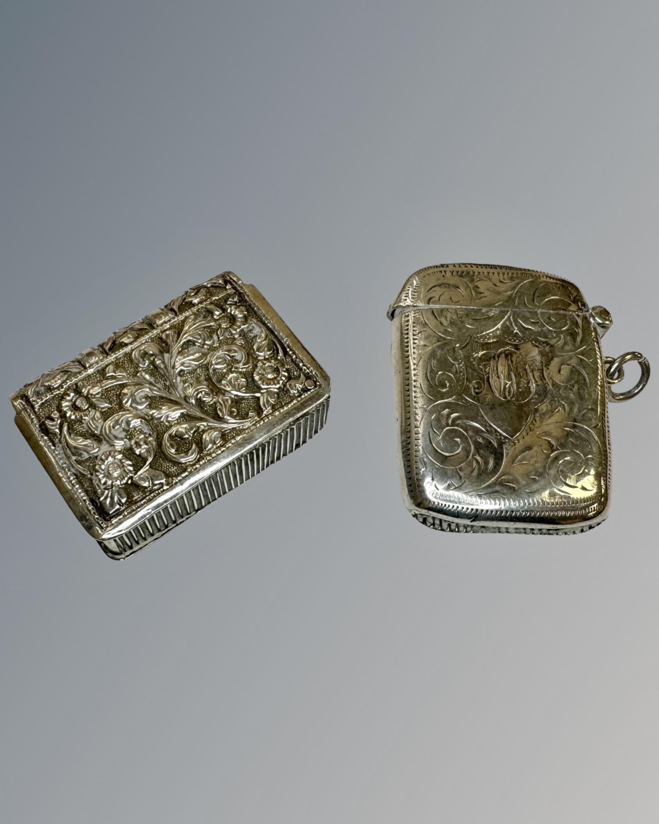 Two silver vesta cases, including one example in the form of a bible.