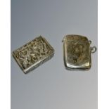 Two silver vesta cases, including one example in the form of a bible.