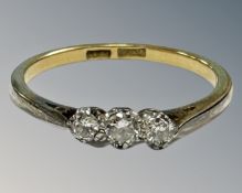 An early 20th century 18ct yellow gold and platinum set three stone diamond ring, P, 2.