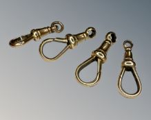 Four antique yellow gold dog catches, 7.3g.