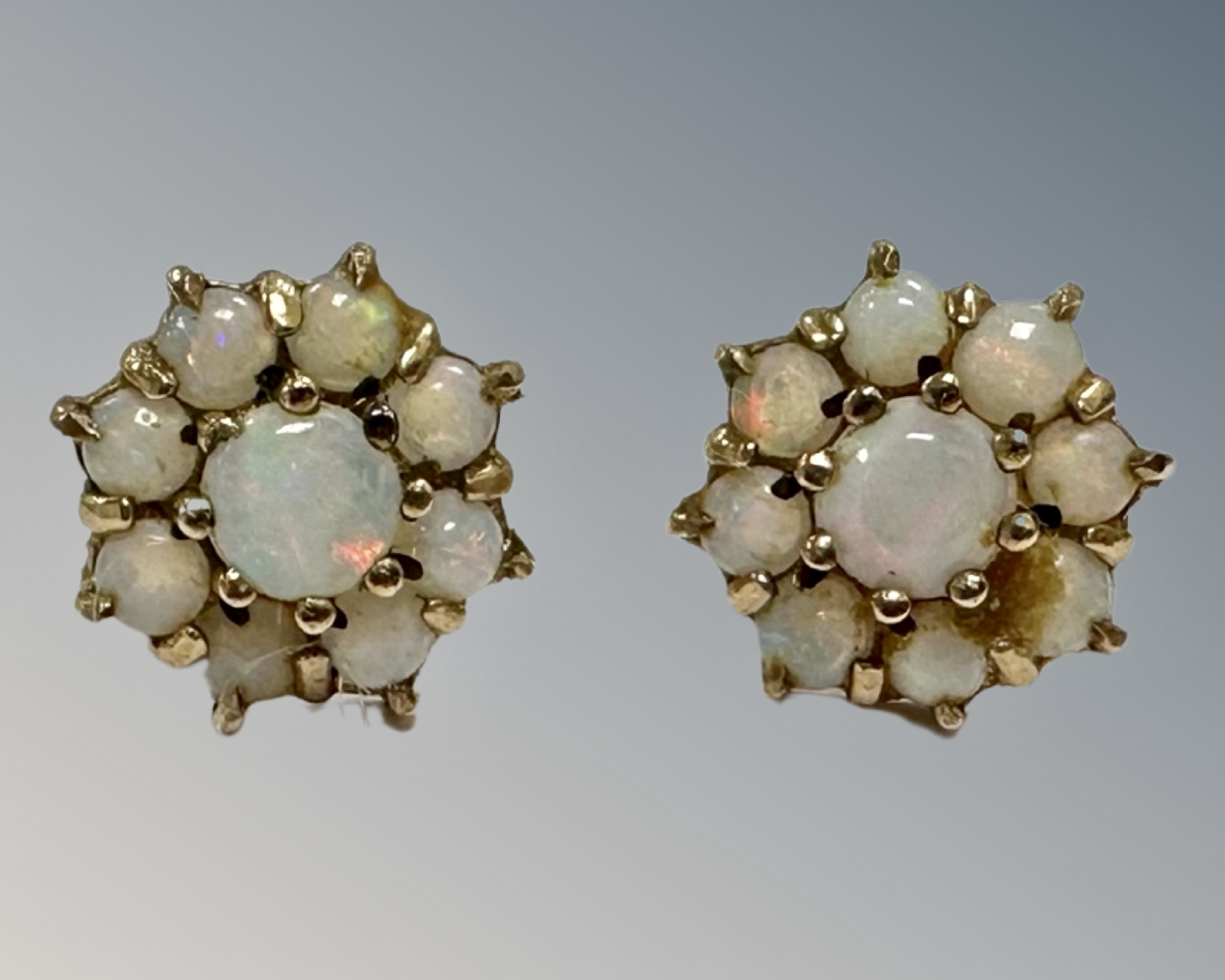 A pair of 9ct yellow gold opal cluster earrings, cluster diameter 10 mm.