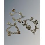 Three silver charm bracelets, 106g.