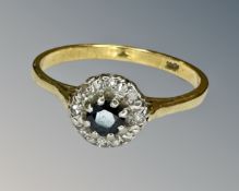 An 18ct gold sapphire and diamond ring, size S.