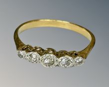 An 18ct gold five stone diamond ring, size O, 2g.