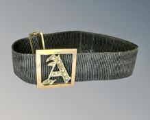 A yellow gold initial 'A' on cloth band set with pearls CONDITION REPORT: 'A' height