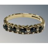 A 9ct gold synthetic sapphire and diamond half eternity ring, 2.4g, N 1/2.