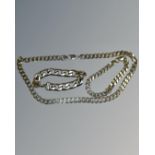 Three silver curb chains, a necklace and two bracelets, 154g total.