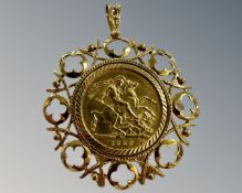 A George V gold full sovereign 1929, mounted in 9ct yellow gold pendant frame, 14.5g.