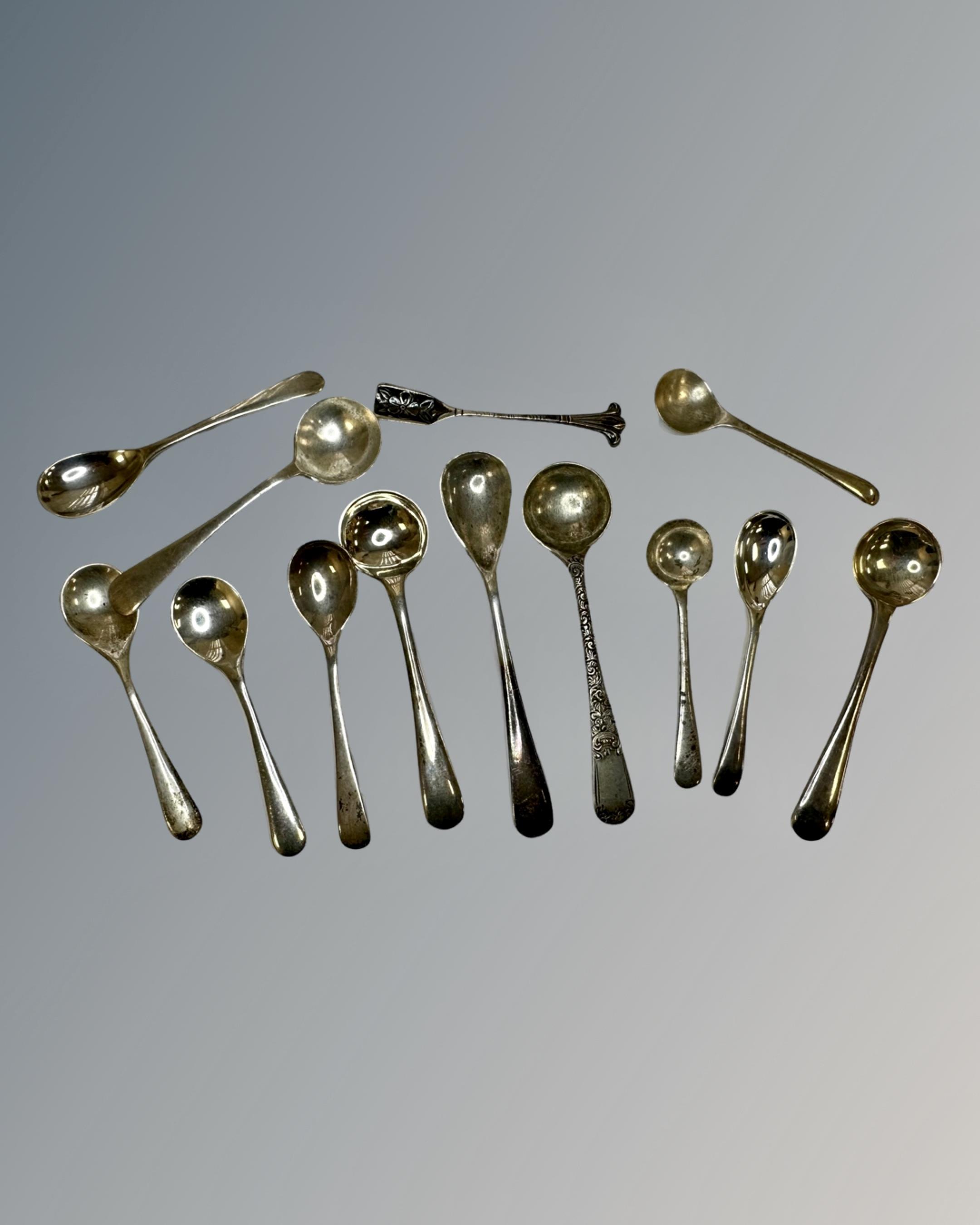 A collection of 14 silver salt spoons.
