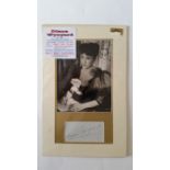 ENTERTAINMENT, signed album page by Diana Wynyard, overmounted beneath photo, half-length seated