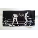 BOXING, signed photo by Henry Cooper showing two images of him standing over Cassius Clay, 16 x 8,