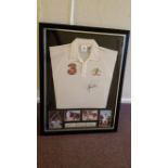 CRICKET, signed replica shirt by Shane Warne, attractively mounted with action photos from his