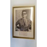 POP MUSIC, signed album page by Roy Orbison, overmounted beneath photo, half-length performing,