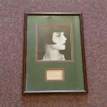 CINEMA, signed piece by Louise Brooks, overmounted beneath photo, h/s in profile, framed & glazed,