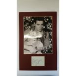 POP MUSIC, signed album page by Eddie Cochran, overmounted beneath photo, half-length performing, 10