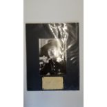 CINEMA, signed album page by Errol Flynn, overmounted beneath photo, half-length in character