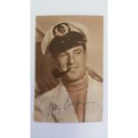 CINEMA, signed postcard, by Gary Cooper, h/s in character wearing sailors hat & smoking a pipe,