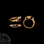Gold Ring with Birds and Garnet