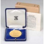 A 22ct gold medallion commemorating nine hundred years of Westminster Abbey, with the original Royal