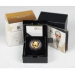 An Elizabeth II Royal Mint quarter-ounce gold proof coin commemorating Elton John, cased.Buyer’s