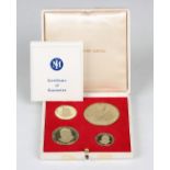 A set of four 18ct gold graduated medallions commemorating Sir Winston Churchill 1874-1965, with