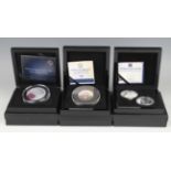 A group of three Bradford Exchange commemorative coins and coin sets, comprising a silver double-