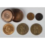 A George V half-sovereign 1913 and a 19th century gilt metal capsule holding two small commemorative