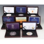 A collection of eight Elizabeth II five ounce silver commemorative coins, including 70th Anniversary