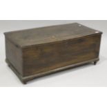 A 19th century stained elm trunk, the interior later lined in paper, height 38cm, width 92cm,