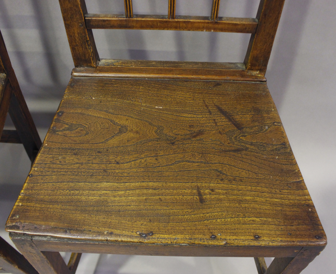 A set of four George III provincial elm rail back dining chairs, height 85cm, width 47cm, depth - Image 5 of 13