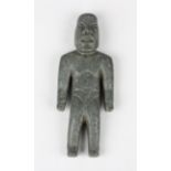 A pre-Columbian Olmec style carved green hardstone standing male figure, probably 900-450 BC,