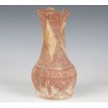 An ancient pottery vase, possibly Mesopotamian, the exterior and rim interior painted with red