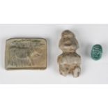 A pre-Columbian Guerrero stone carved figural amulet, length 5.2cm, together with a clay tablet,