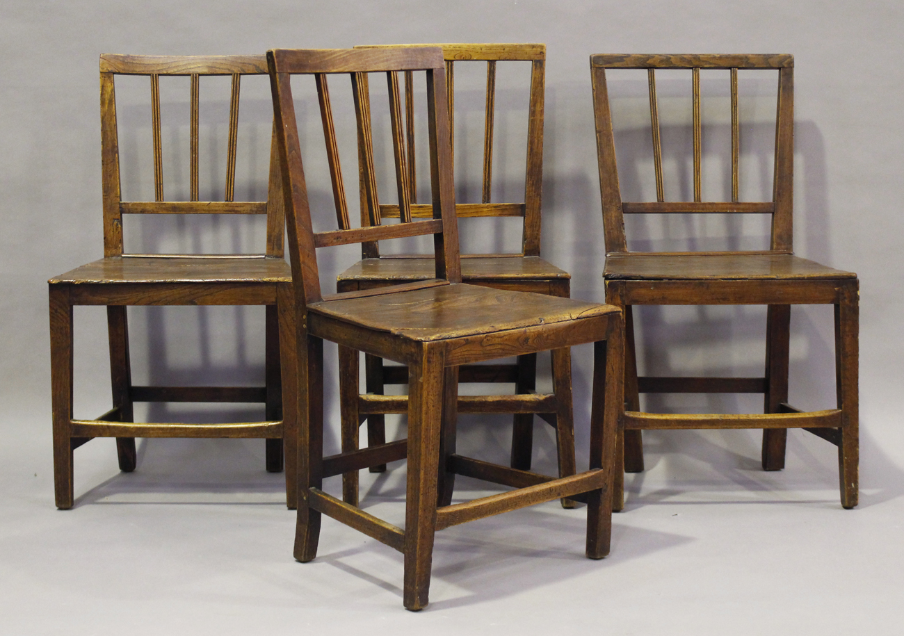 A set of four George III provincial elm rail back dining chairs, height 85cm, width 47cm, depth