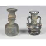 Two Roman style pottery oil lamps and two glass vases.Buyer’s Premium 29.4% (including VAT @ 20%) of