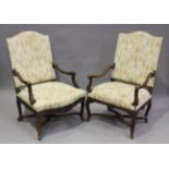A near pair of 19th century French walnut framed armchairs, upholstered in patterned fabric,