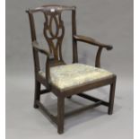 A George III mahogany gentleman's elbow chair with a pierced splat back and drop-in seat, height
