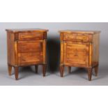 A pair of early 20th century Continental walnut and foliate inlaid bedside chests of three