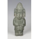 A pre-Columbian style carved green hardstone duality figure, modelled to both sides representing