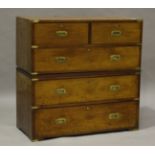 A late 19th century mahogany and brass bound campaign chest of two short and three long drawers,