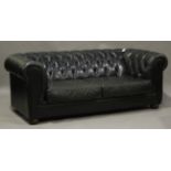 A late 20th century buttoned green leather Chesterfield settee, height 71cm, width 202cm, depth