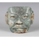 A pre-Columbian Olmec style carved jade mask, probably 900-450 BC, bearing collector's label to