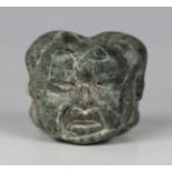 A pre-Columbian Olmec style carved green hardstone bead, probably 900-450 BC, finely modelled with