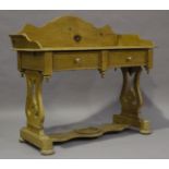 A late 19th century Continental pine washstand side table, height 99cm, width 109cm, depth 50cm,