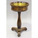 A William IV rosewood jardinière table, the interior fitted with a brass pan, the tapering sides