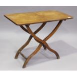 A Victorian mahogany coaching table, raised on a folding 'X' frame base, height 67cm, width 89cm,