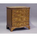 A 20th century reproduction mahogany serpentine fronted chest, fitted with a brushing slide,